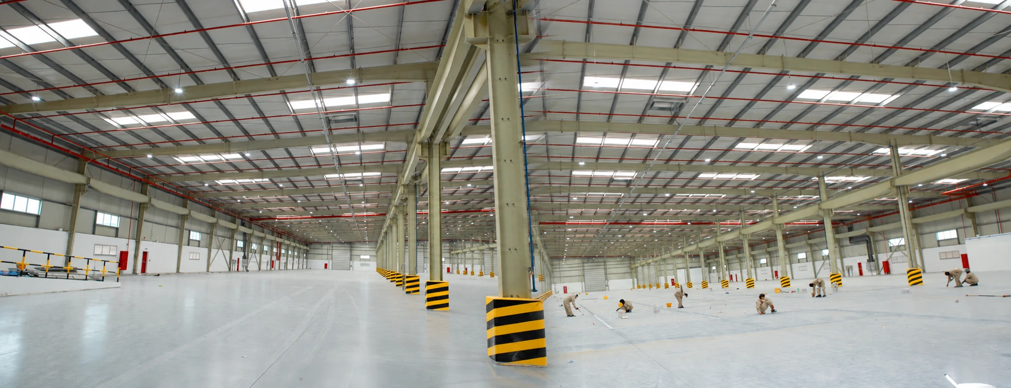 Completed steel building interior showing columns and roof framing
