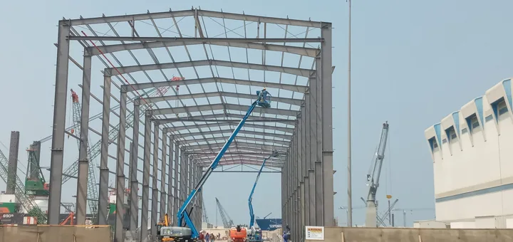 Steel frame erection at a Roofings Middle East project